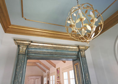 Sylvia T Designs_Distressed cased opening finish with gold leaf detailing, gilding of crown molding and chandelier, New Orleans
