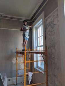 Sylvia T Designs – French Quarter Creole Cottage – Dramatic Plaster Finishes and Gold Leaf Ceilings – Working on prepping the walls. Sylvia Thompson-Dias of Sylvia T Designs.