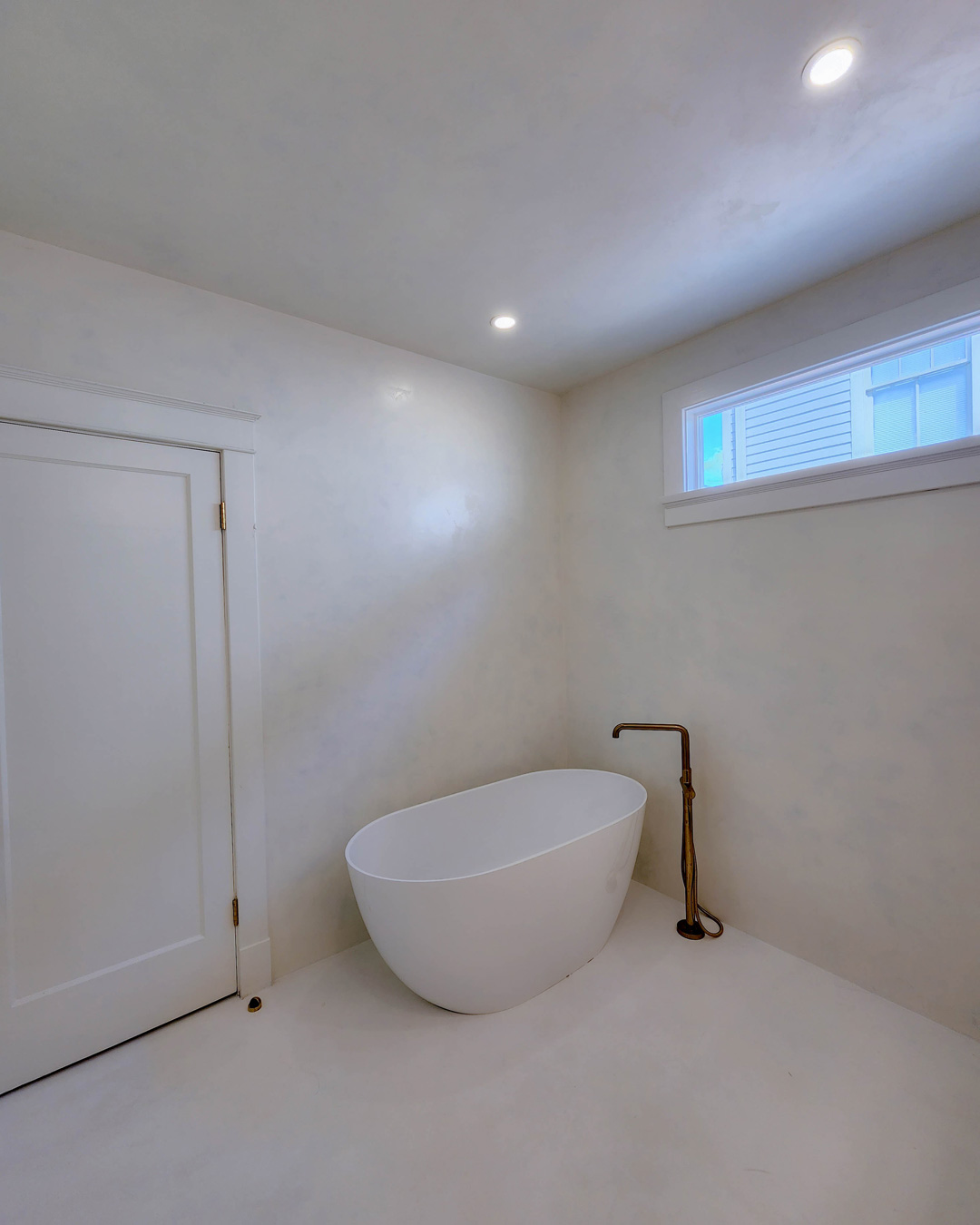 Another look at the bathroom where you can see the beautiful, clean look of microcement all around the space. It is perfect for both wet and dry applications. Microcement by Sylvia T Designs and Gulf Coast Plaster Artisans.