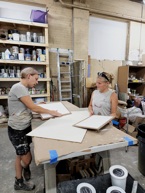 Sylvia T Designs - Two of our Artisans working on plaster samples in our New Orleans shop space.